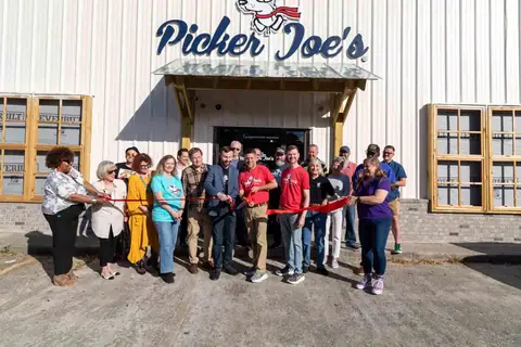 Ribbon-cutting crowd in front of the new Picker Joe's storefront at Picker Joe's Antique Mall in Savannah, GA
