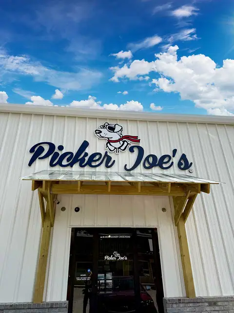 The new Picker Joe's storefront and sign under a blue sky at Picker Joe's Antique Mall in Savannah, GA