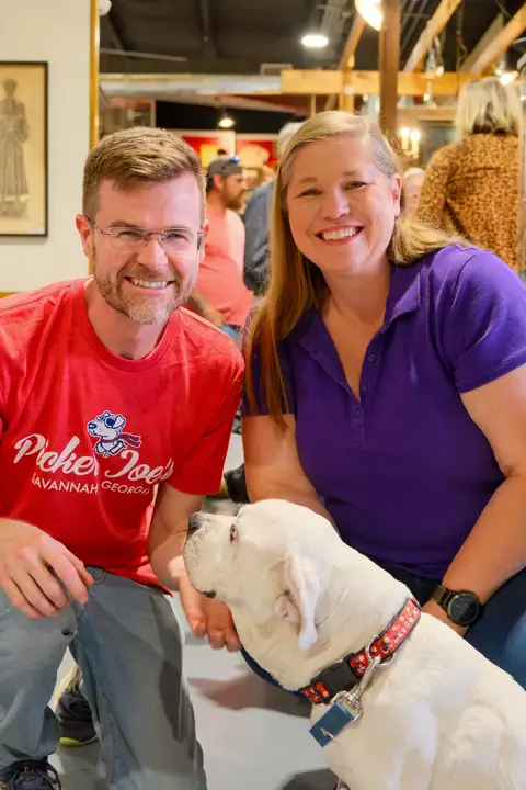 Guests with a dog at the grand opening, which raised money for Coastal Pet Rescue at Picker Joe's Antique Mall in Savannah, GA