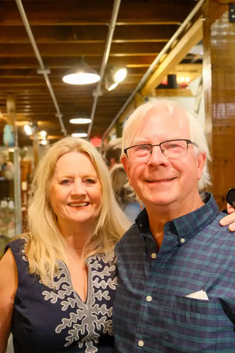 Two guests smiling at the grand opening at Picker Joe's Antique Mall in Savannah, GA