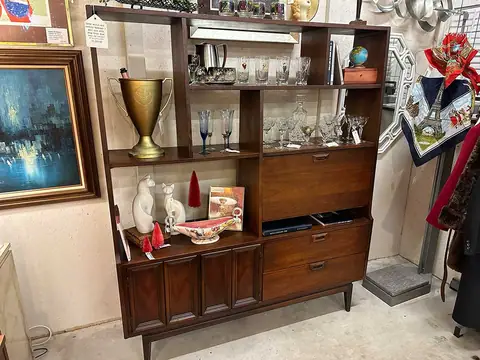 Mid-century bookcase hutch with glassware and art at Picker Joe's Antique Mall in Savannah, GA