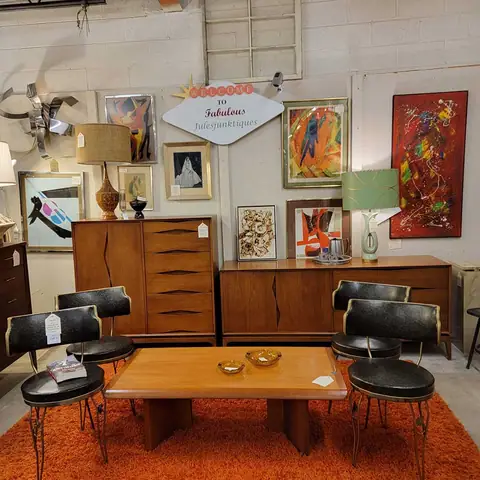 Walnut sideboard and coffee table with black mid-century chairs at Picker Joe's Antique Mall in Savannah, GA