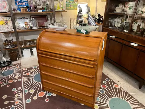 Mid-century roll-top cabinet on an atomic-pattern rug at Picker Joe's Antique Mall in Savannah, GA