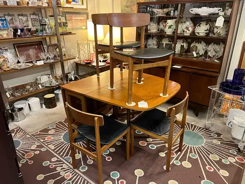 Mid-century dining set on an atomic starburst rug at Picker Joe's Antique Mall in Savannah, GA