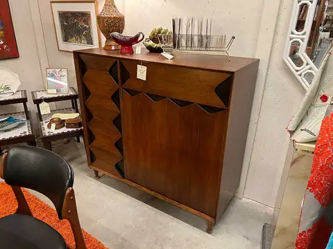 Walnut dresser with a sculpted front at Picker Joe's Antique Mall in Savannah, GA