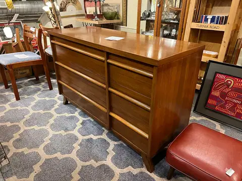 Walnut dresser on a gray trellis rug at Picker Joe's Antique Mall in Savannah, GA