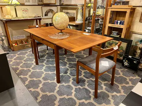 Mid-century drop-leaf dining table with a globe at Picker Joe's Antique Mall in Savannah, GA