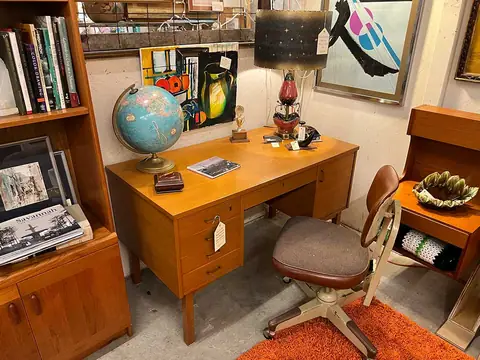 Walnut desk with a desk chair and bookshelf at Picker Joe's Antique Mall in Savannah, GA