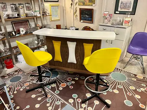 Mid-century bar with yellow swivel stools at Picker Joe's Antique Mall in Savannah, GA