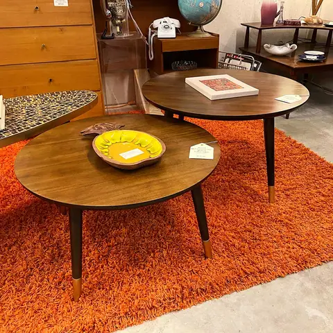 Round mid-century coffee table and side table on an orange rug at Picker Joe's Antique Mall in Savannah, GA