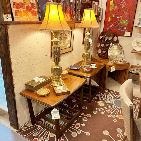 Mid-century end tables with brass table lamps on an atomic rug at Picker Joe's Antique Mall in Savannah, GA