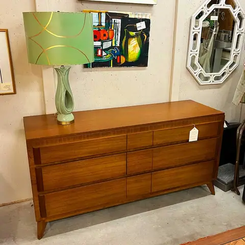Walnut dresser with a green table lamp at Picker Joe's Antique Mall in Savannah, GA
