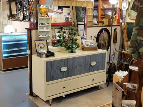 Cream mid-century dresser with blue-gray drawers at Picker Joe's Antique Mall in Savannah, GA
