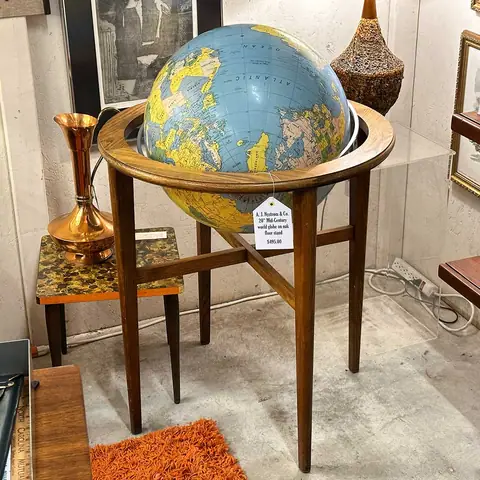 Mid-century globe in a wooden floor stand at Picker Joe's Antique Mall in Savannah, GA