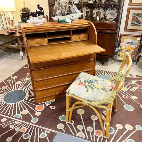 Mid-century secretary desk with a bamboo chair at Picker Joe's Antique Mall in Savannah, GA