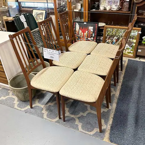 Set of mid-century dining chairs with cream seats at Picker Joe's Antique Mall in Savannah, GA