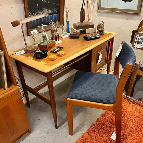 Mid-century writing desk with a blue chair at Picker Joe's Antique Mall in Savannah, GA