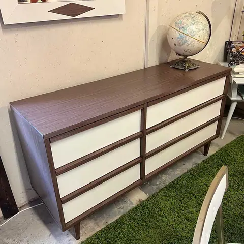 Two-tone mid-century dresser with a globe at Picker Joe's Antique Mall in Savannah, GA