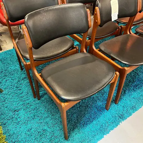 Set of mid-century dining chairs with black seats at Picker Joe's Antique Mall in Savannah, GA