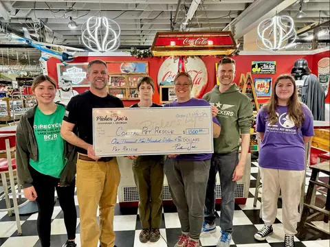 Presenting a donation check to Coastal Pet Rescue at Picker Joe's Antique Mall in Savannah, GA