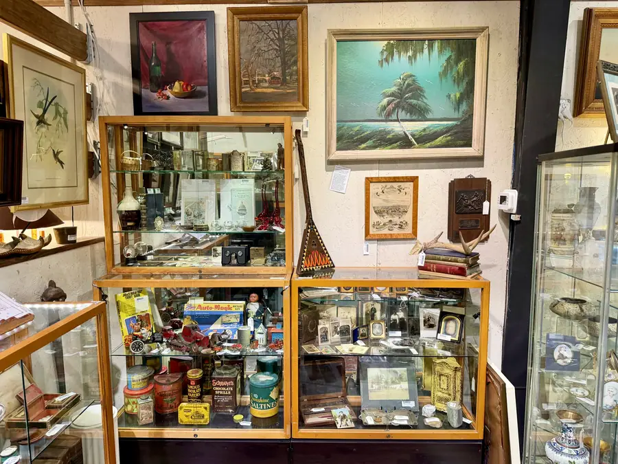Display cases and paintings at Picker Joe's Antique Mall in Savannah, GA